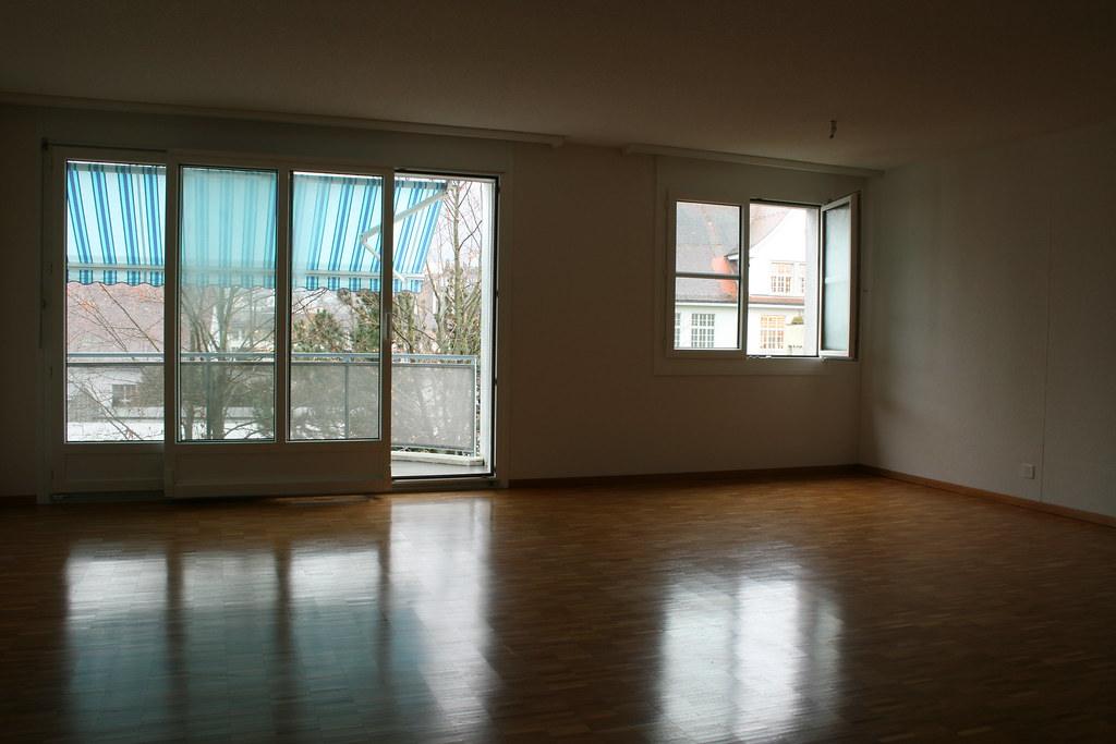 A bright furnished apartment living room prepared for cleaning